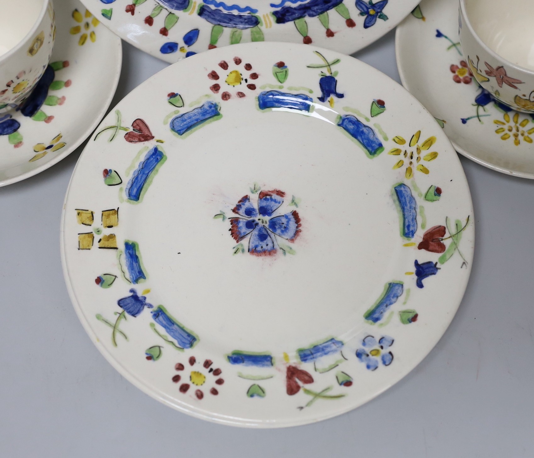 Jessie Marion King (1875-1949). Three different floral design tea cups, saucers and plates